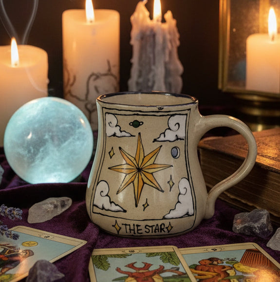 The star tarot card painted on a hand made mug