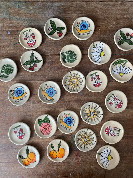 ceramic art trinket dishes with whimsical and cottage core hand painted motifs. rustic style pottery 